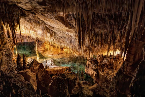 A look inside h-the stalagmite cave - Dragon cave, Coves del Drach, (Cuevas del Drach). Stalactite mysterious underground caverns. Porto Cristo Balearic Islands Mallorca Spain.